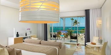 a room with a bed and a large chandelier over it