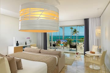 a room with a bed and a large chandelier over it