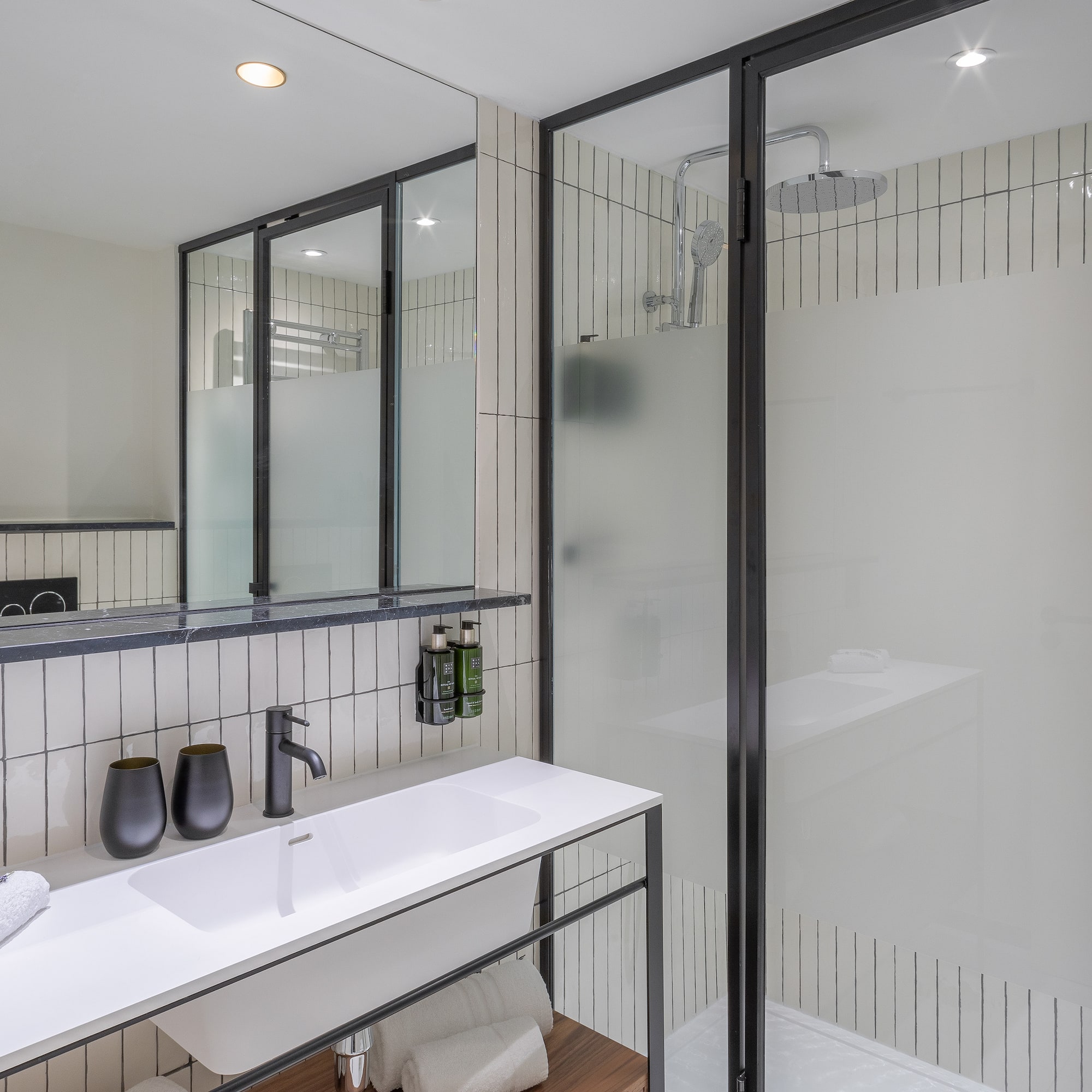 a bathroom with a shower and sink