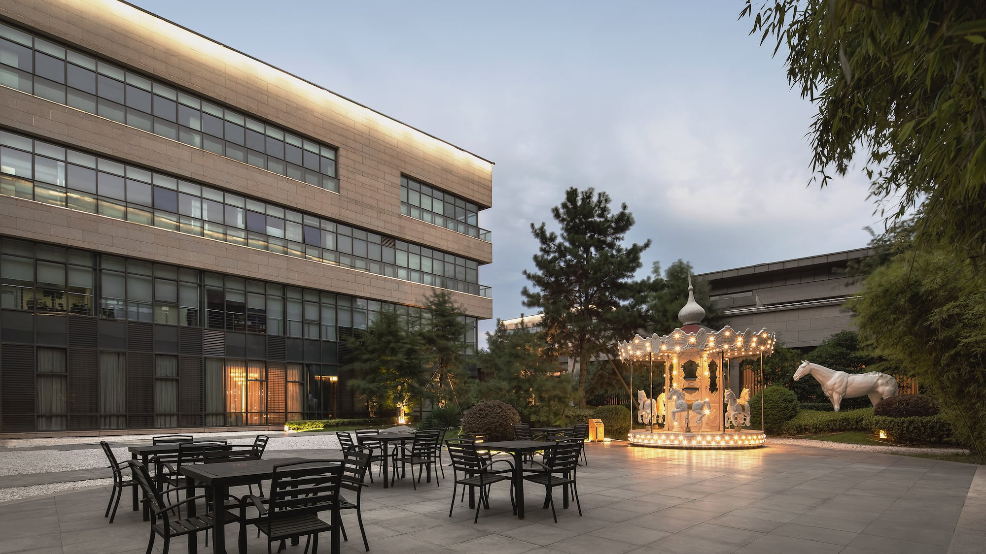 a building with a carousel and tables