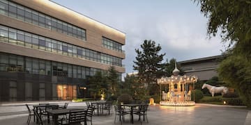 a building with a carousel and tables