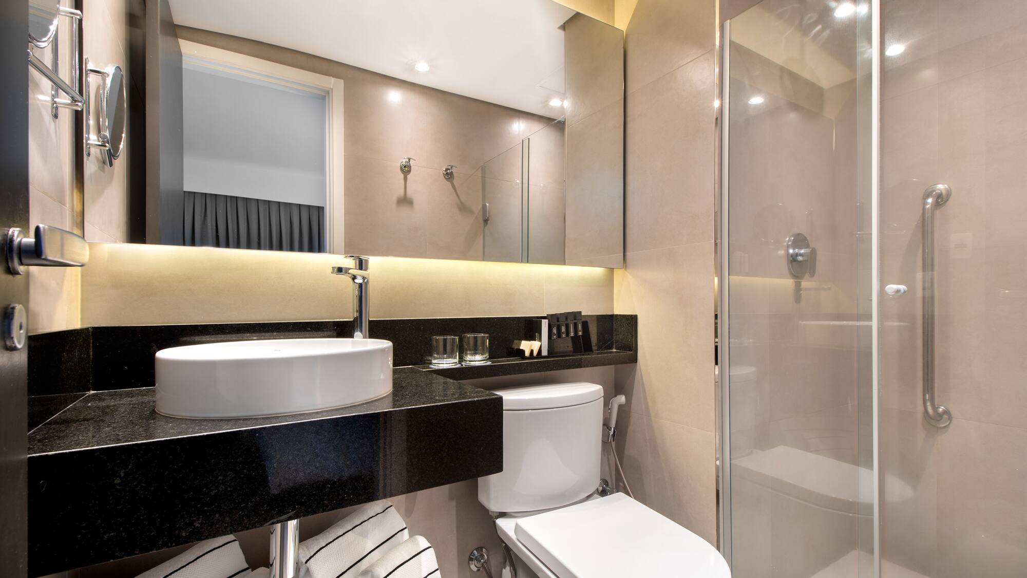 a bathroom with a sink and shower