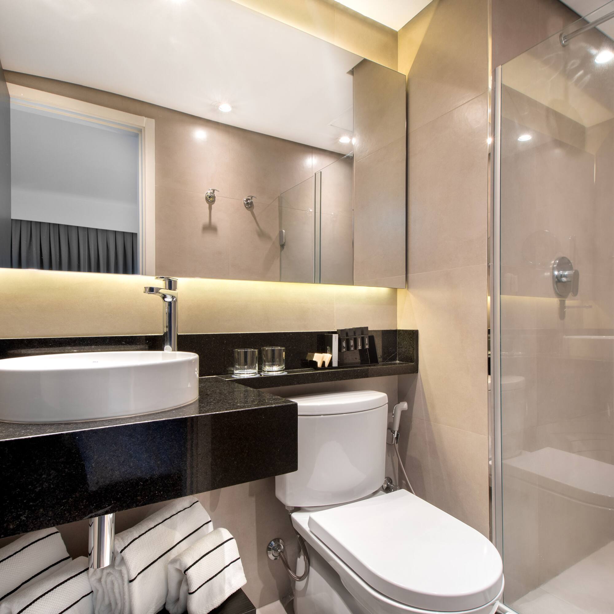 a bathroom with a sink and shower