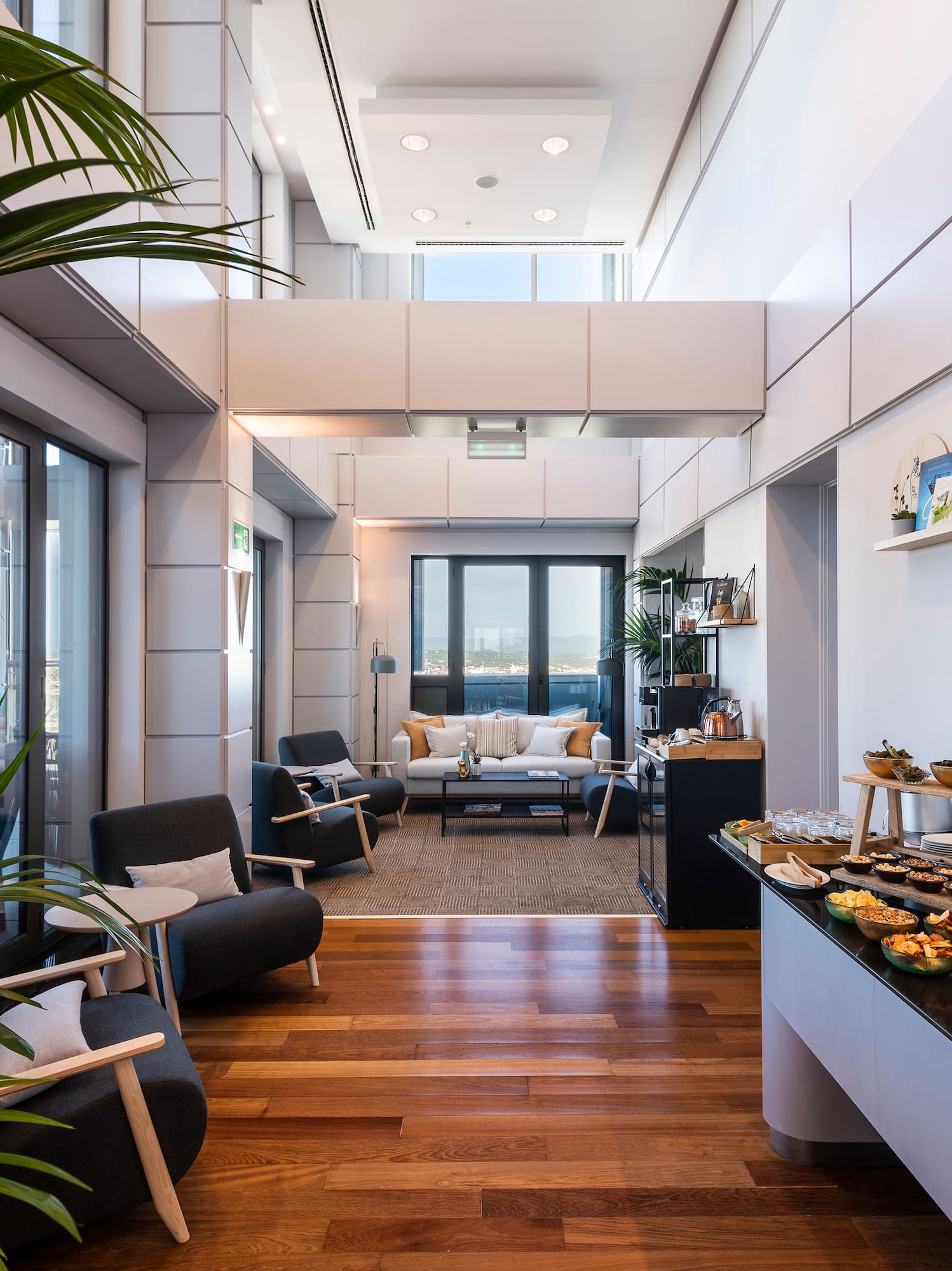 a room with a table of food and a couch