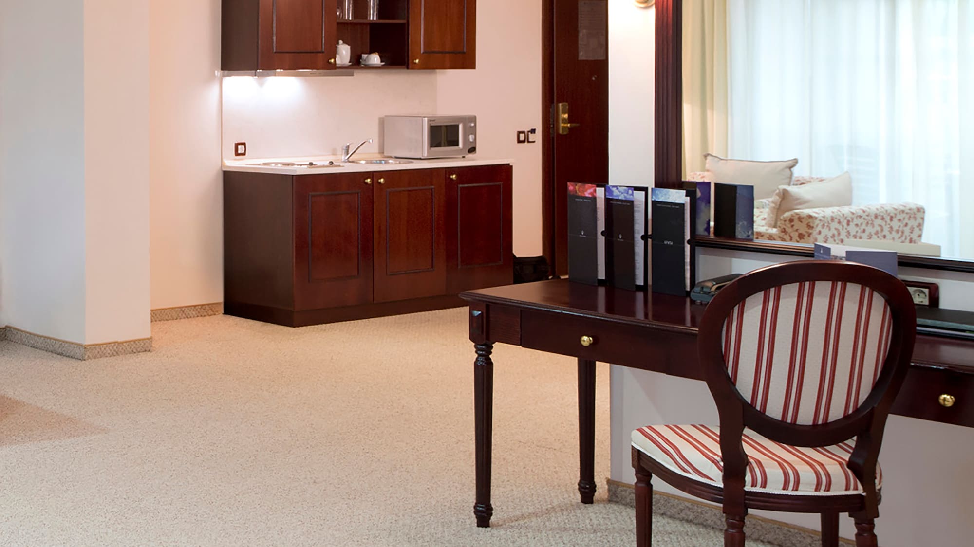 a room with a mirror and a desk