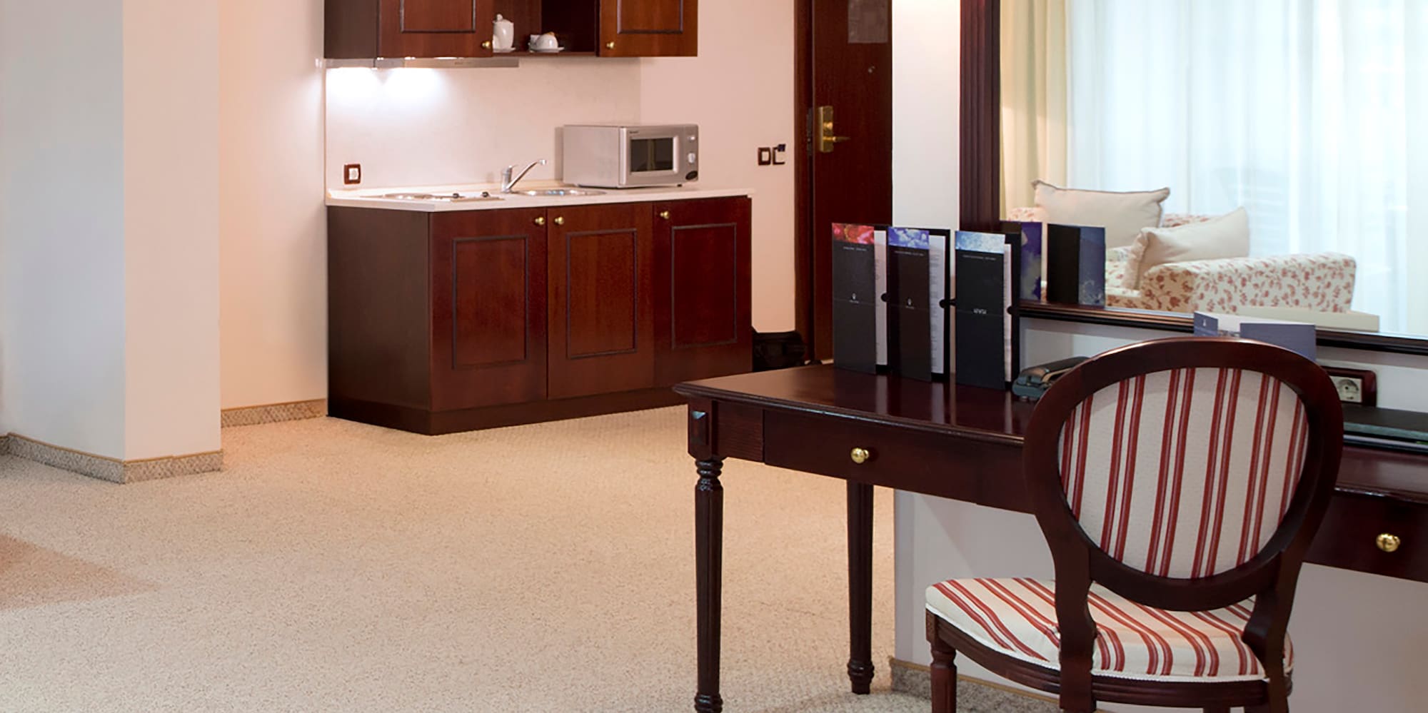 a room with a mirror and a desk