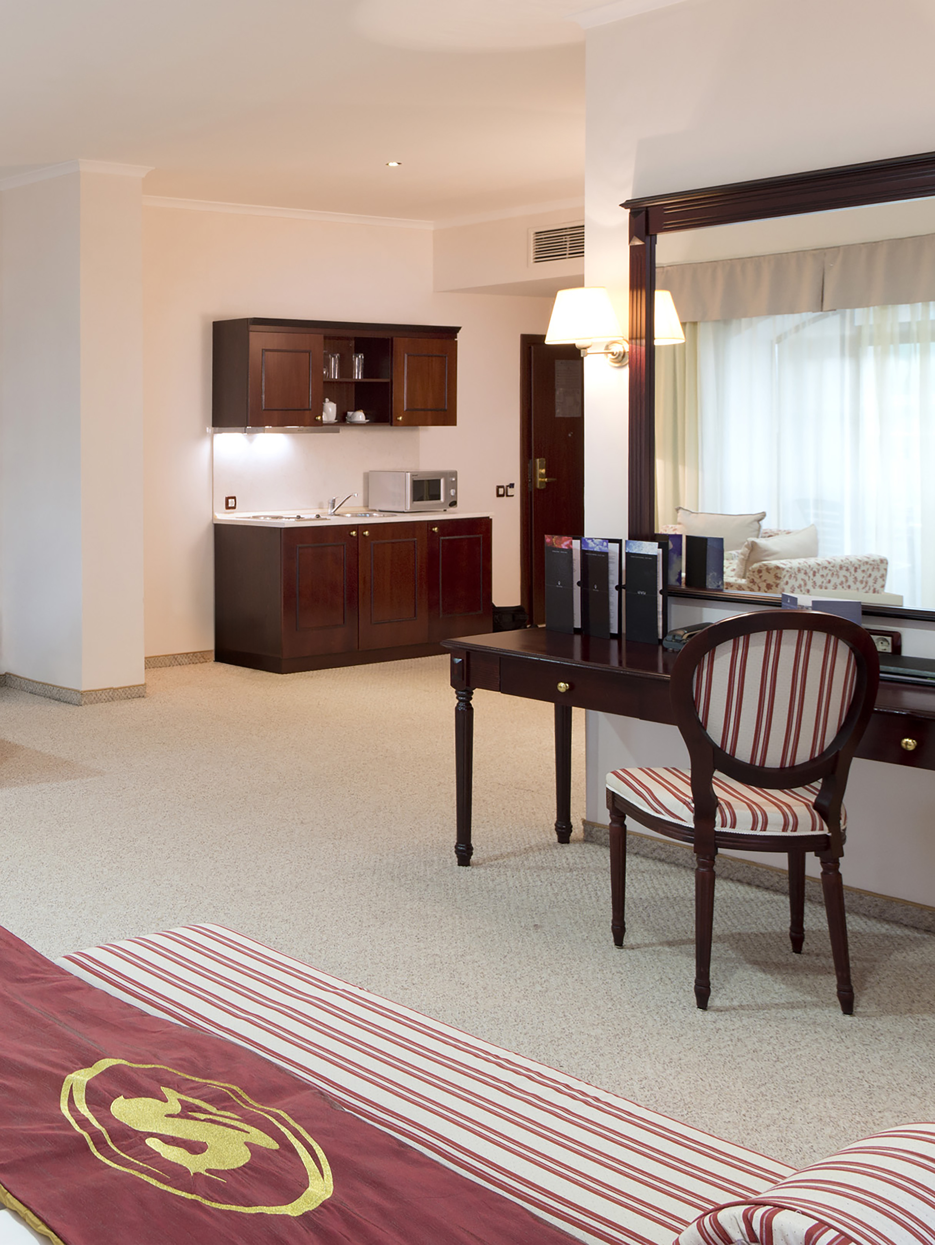 a room with a mirror and a desk