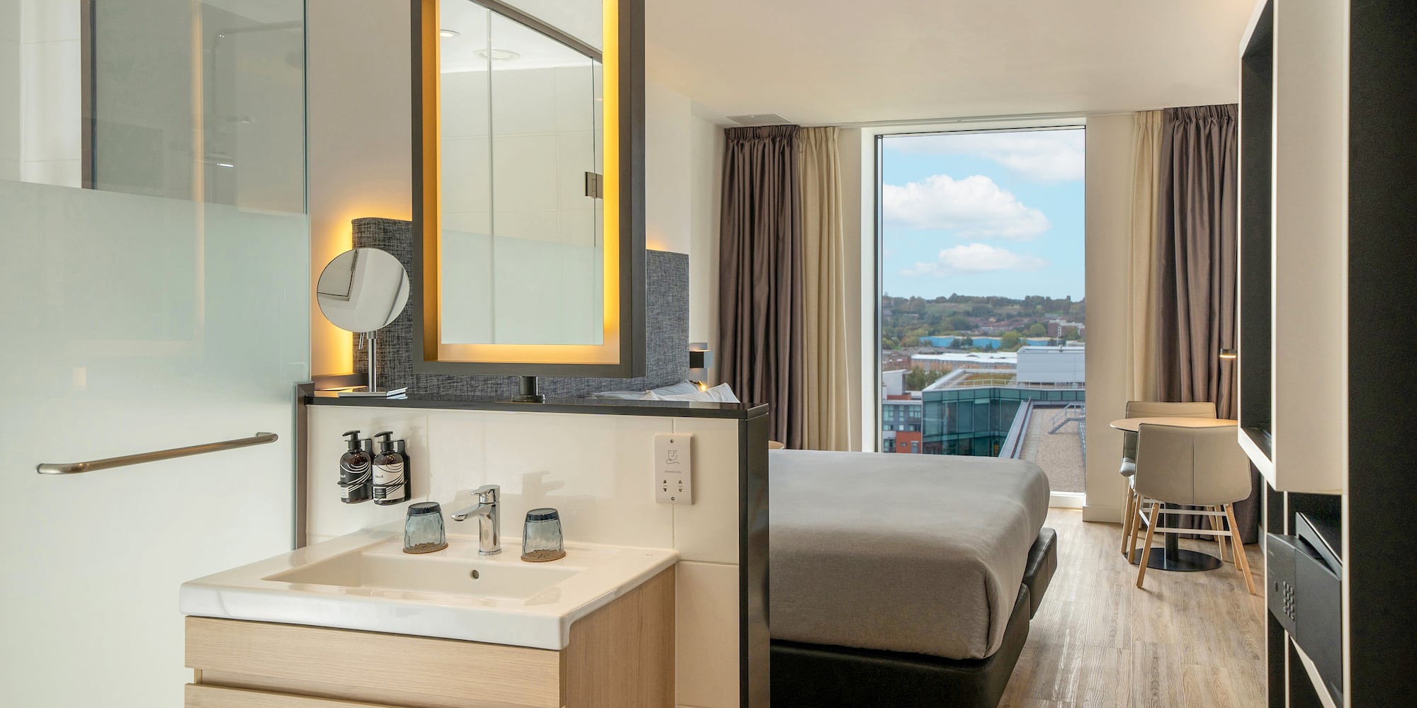 a room with a bed and sink