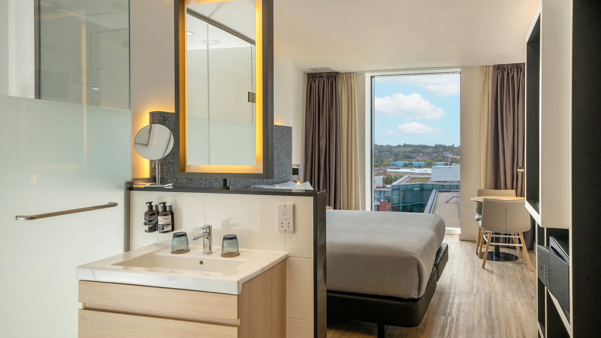 a room with a bed and sink