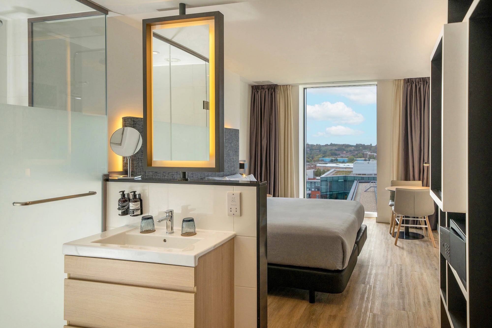 a room with a bed and sink