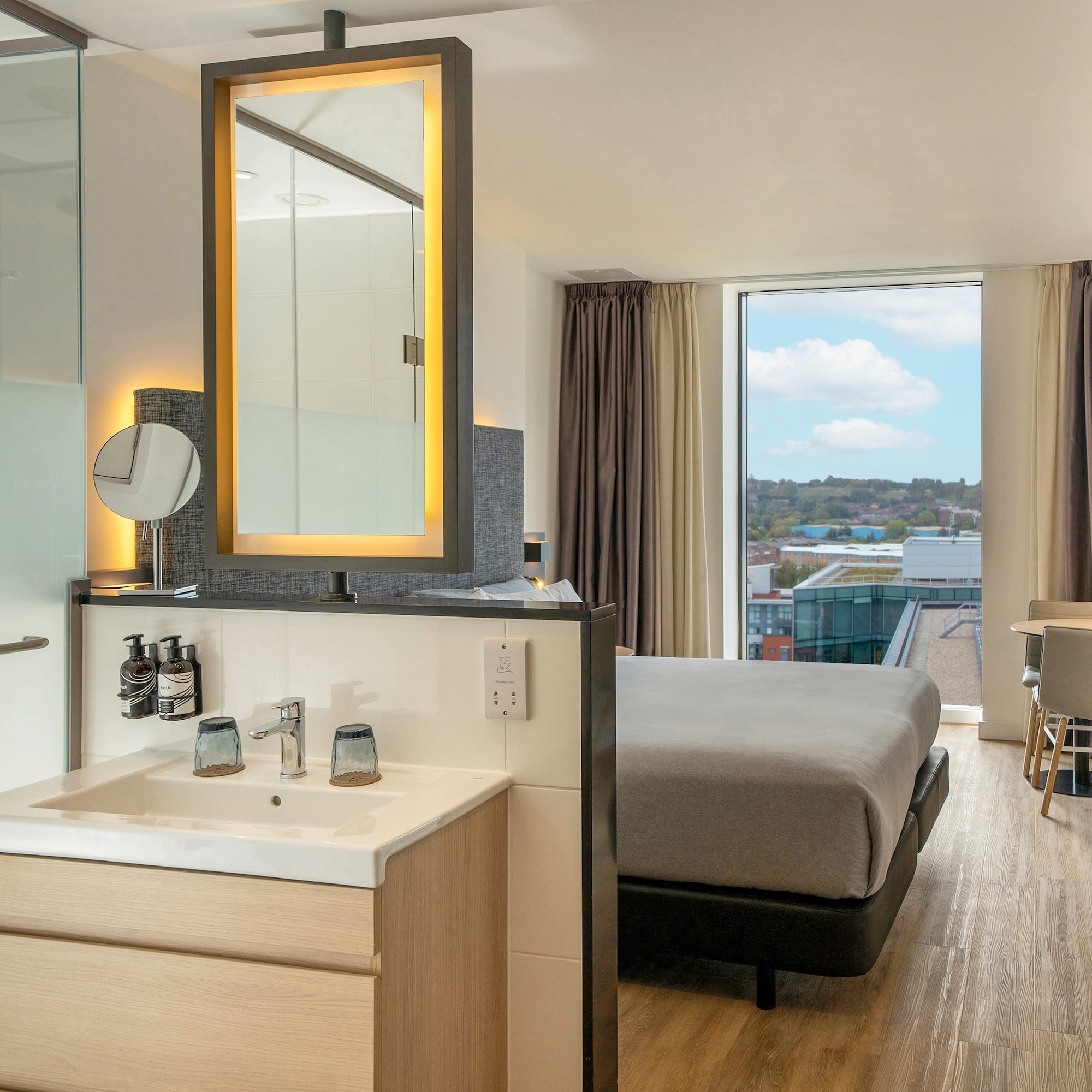 a room with a bed and sink