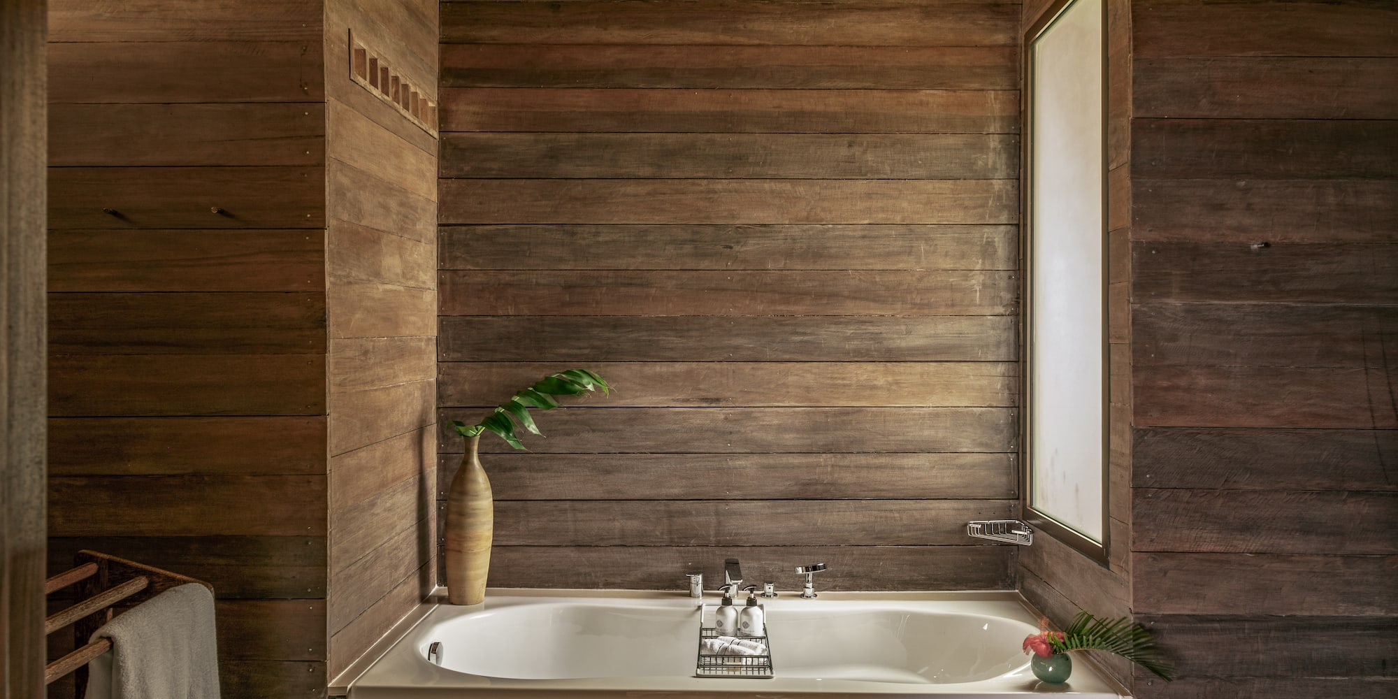 a bathtub in a wood room