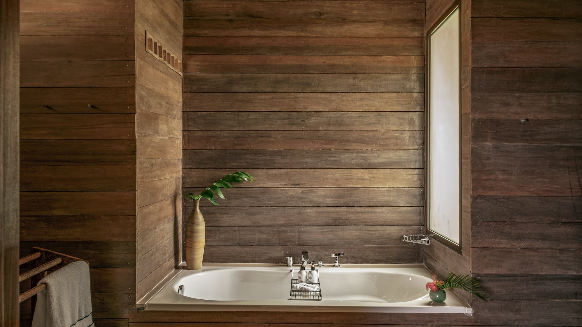 a bathtub in a wood room