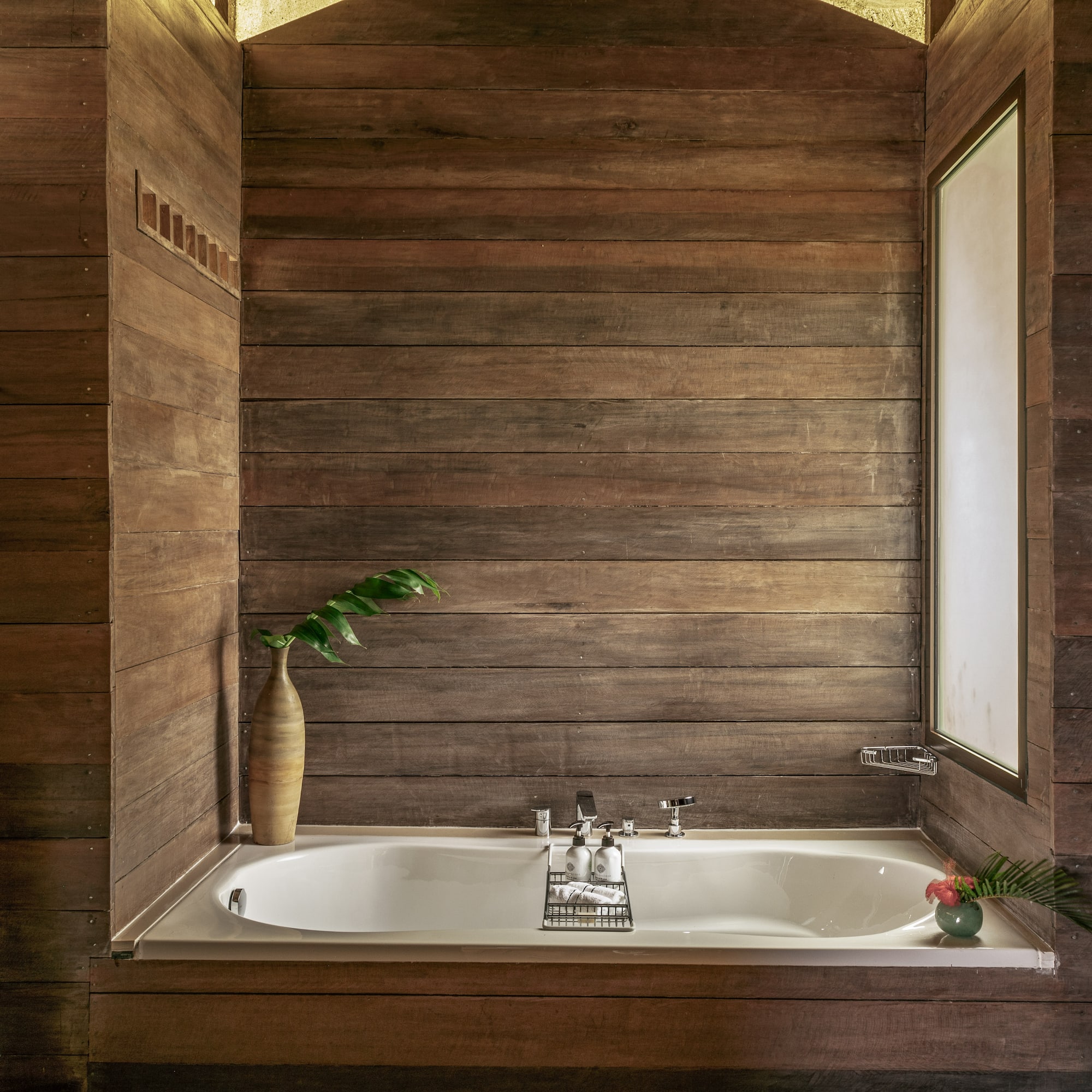 a bathtub in a wood room