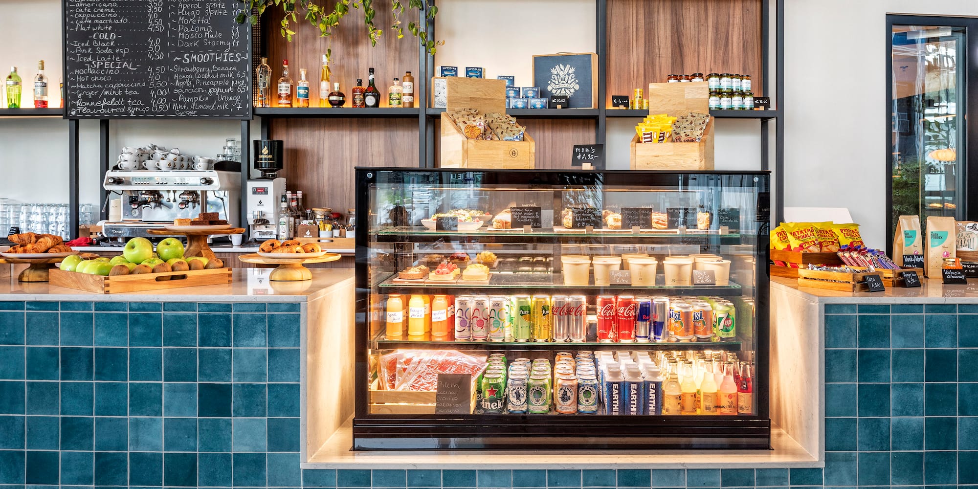 a display case with drinks and beverages in it