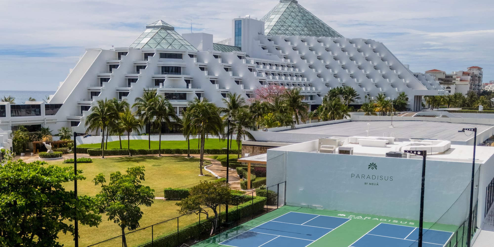 Paradisus by Meliá pyramid resort with rooftop sports court and ocean view.