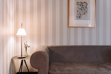 a couch and a lamp in a room