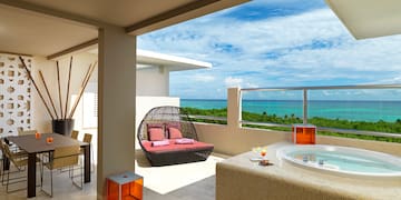 a hot tub with a view of the ocean