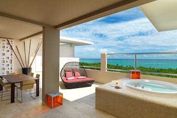 a hot tub with a view of the ocean
