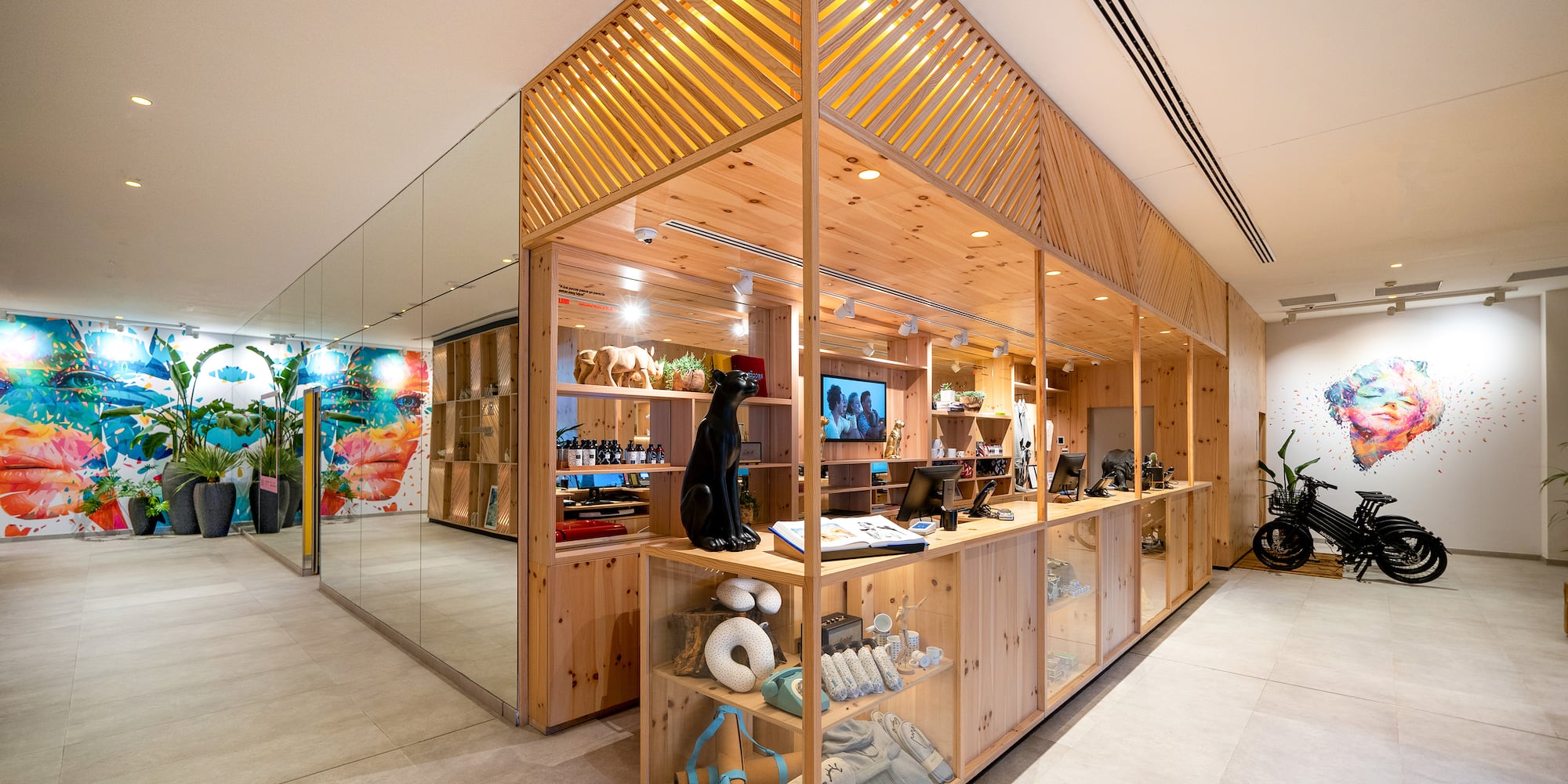 a store with a glass wall and shelves