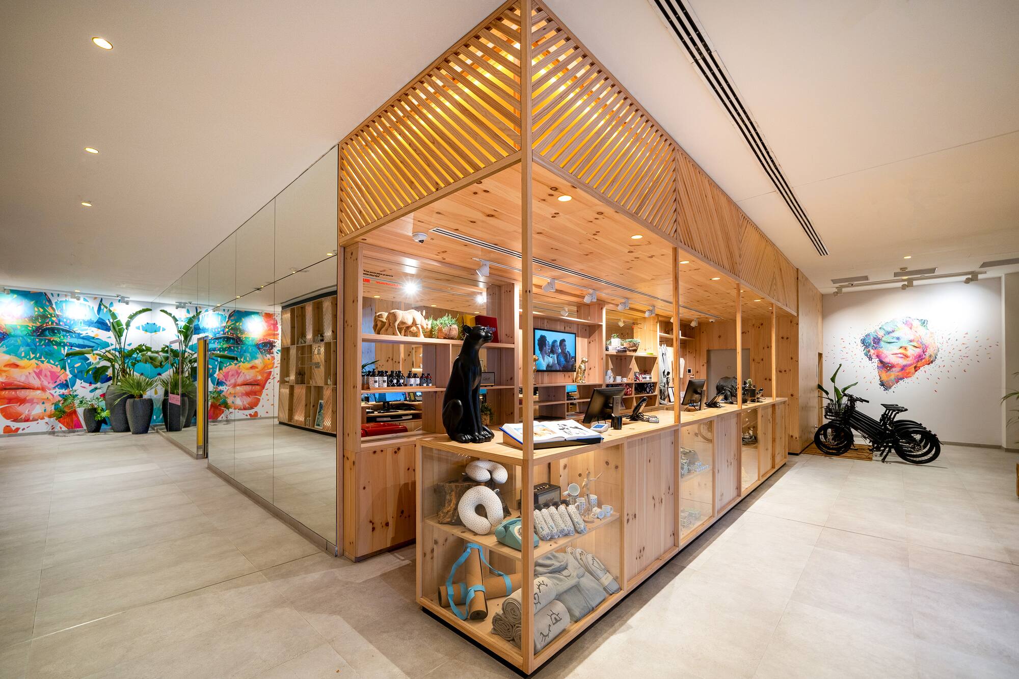 a store with a glass wall and shelves