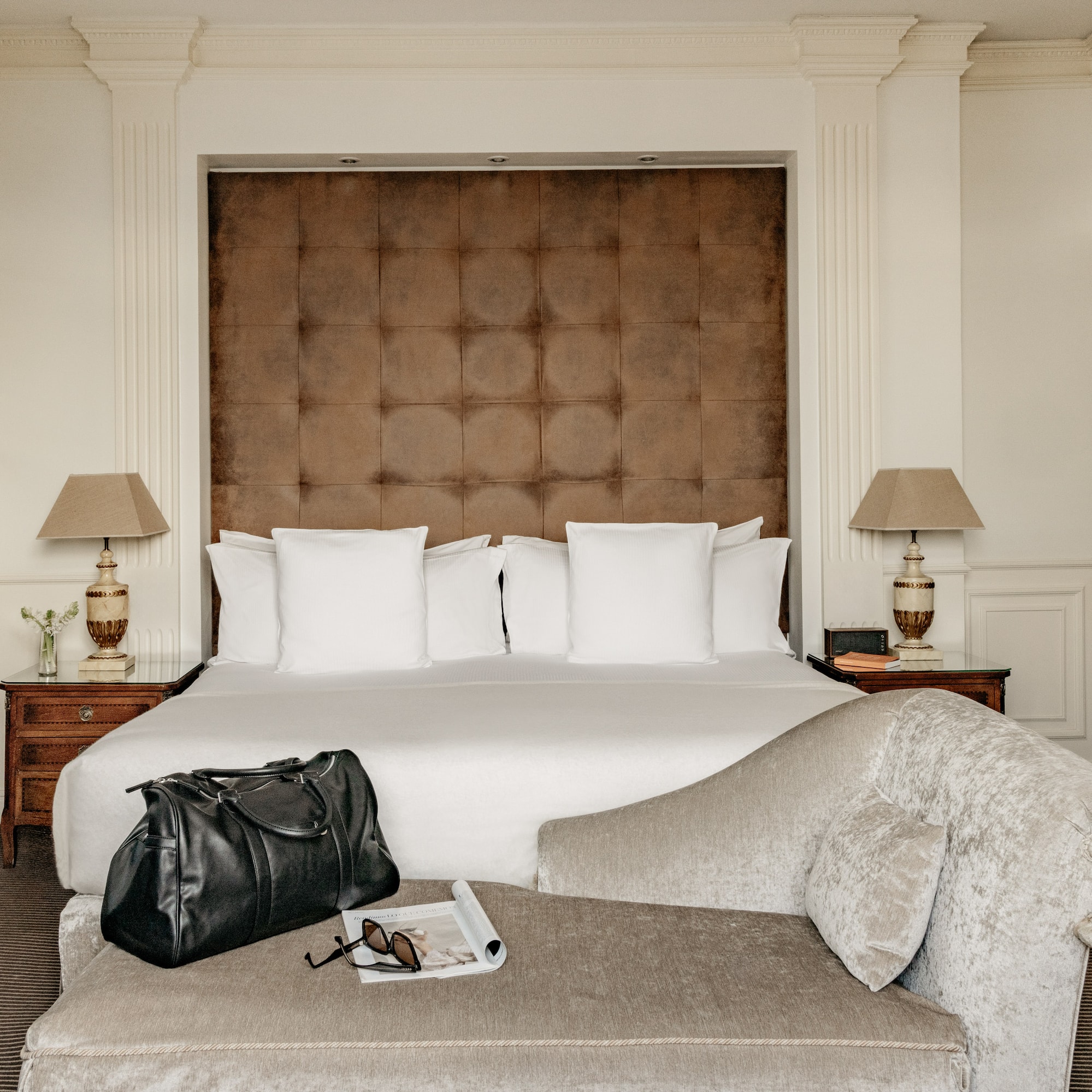 a bed with a bag and a coffee table