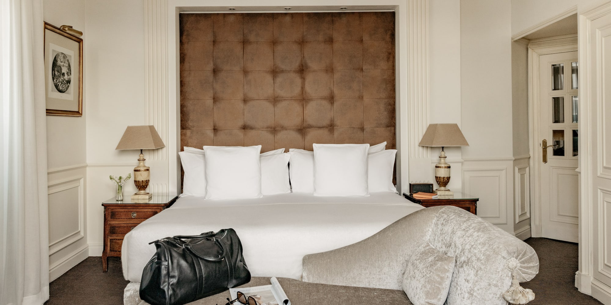 a bed with a bag and a coffee table