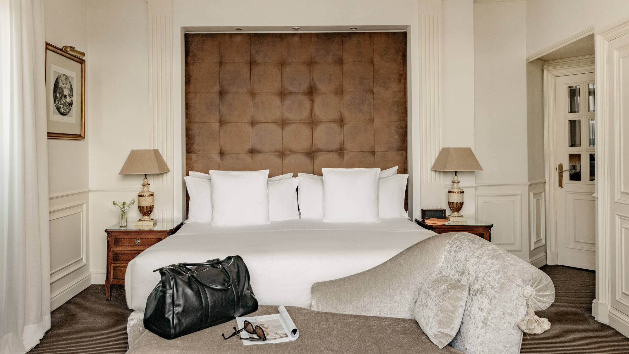 a bed with a bag and a coffee table