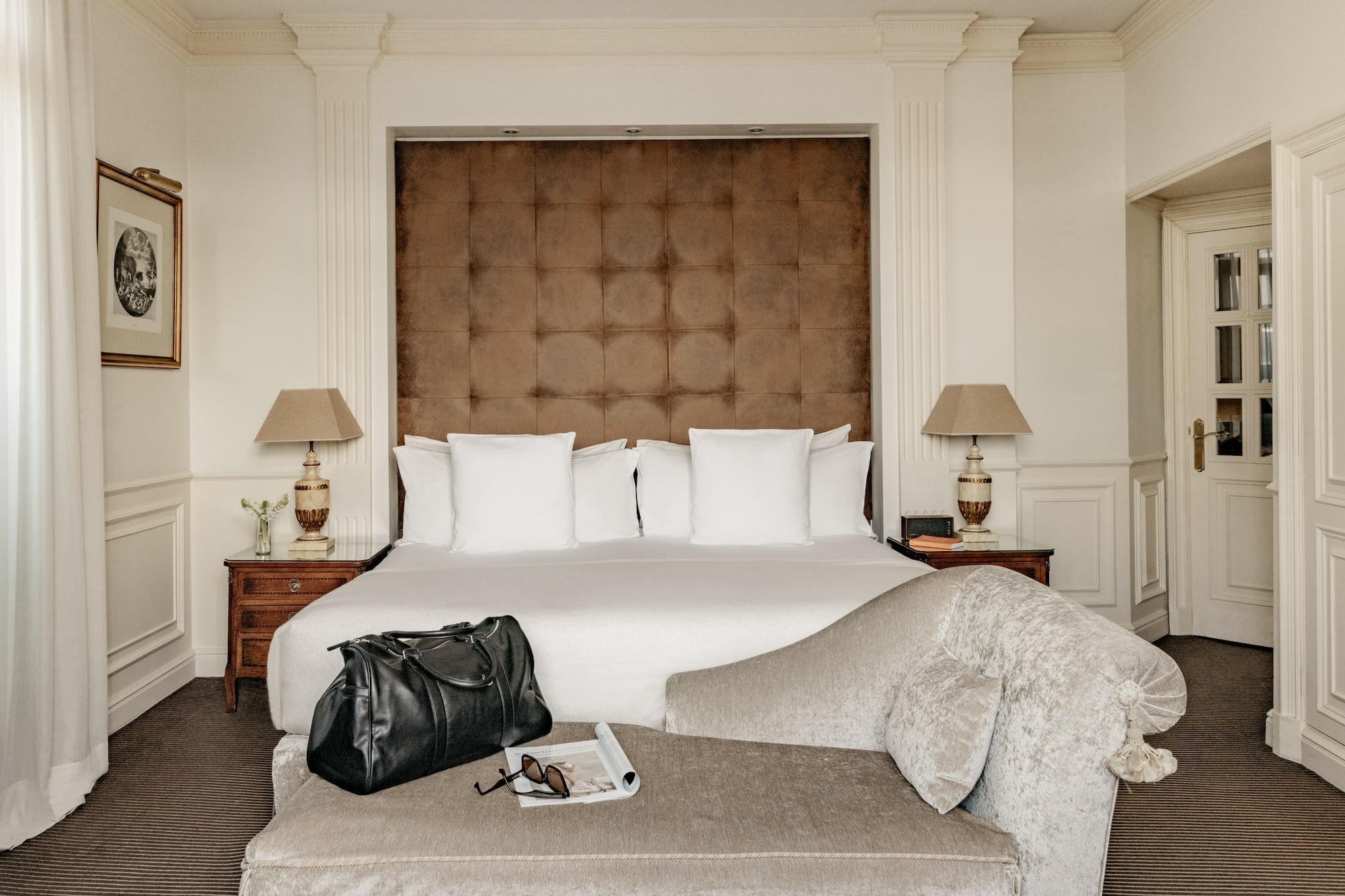 a bed with a bag and a coffee table