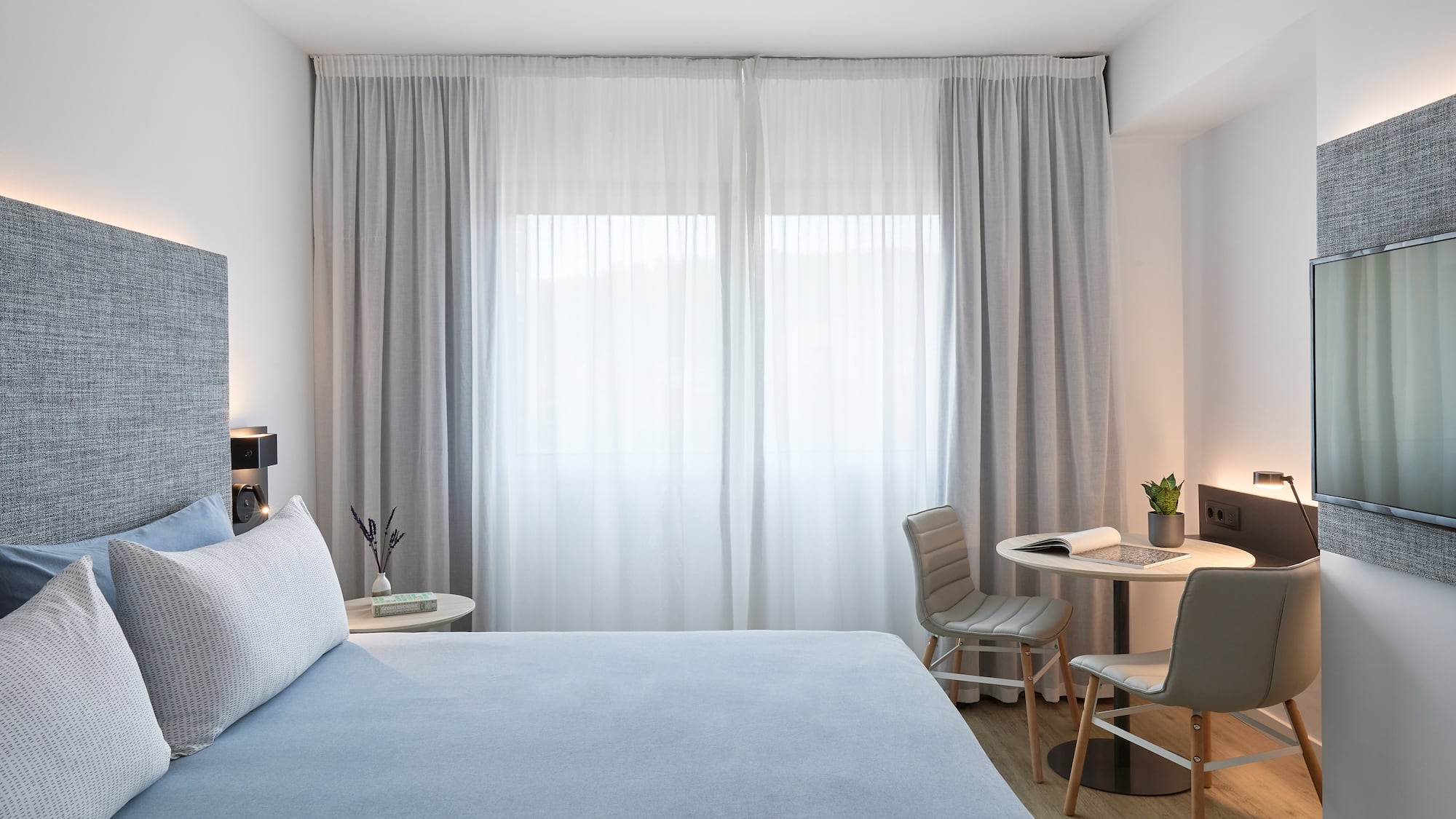 a bed and chair in a room