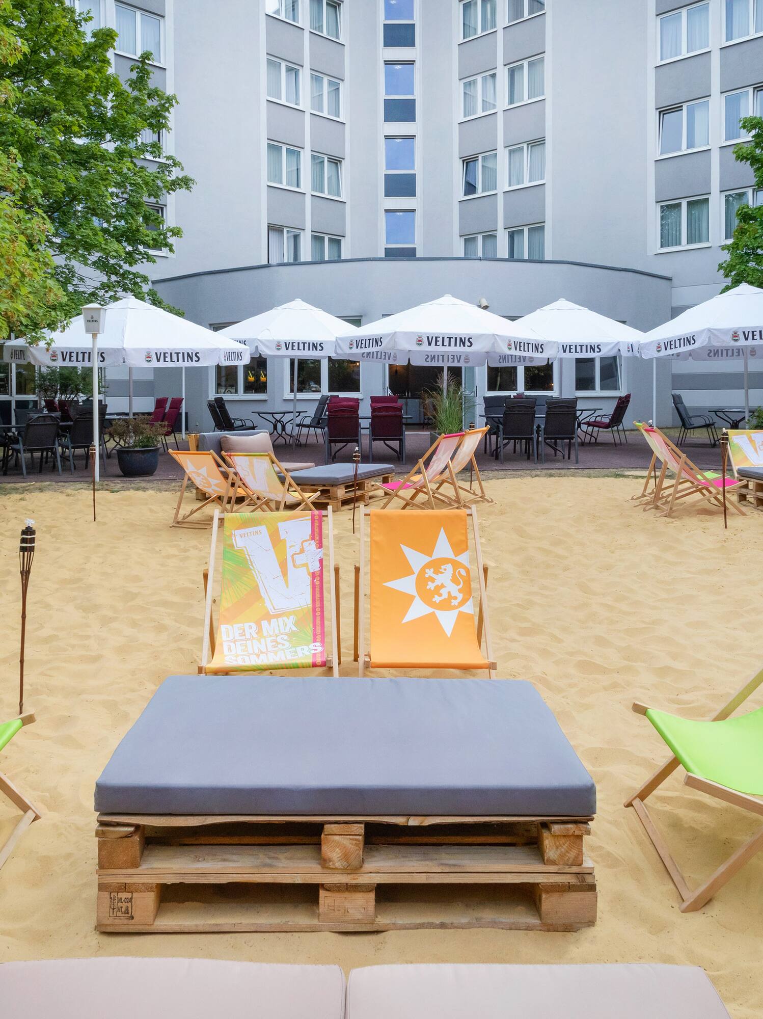 a group of chairs in a sand area