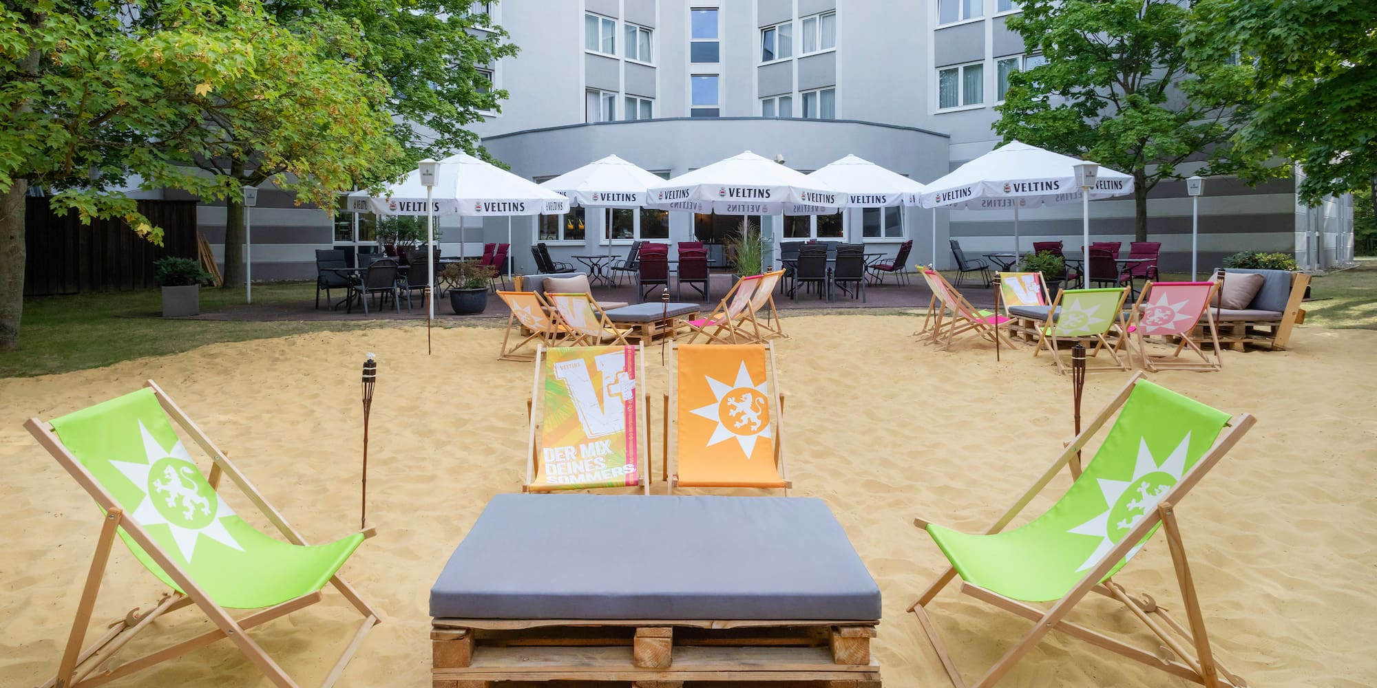 a group of chairs in a sand area