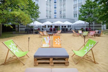 a group of chairs in a sand area