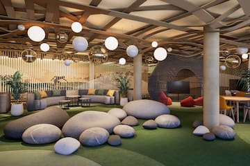 a large room with large rocks and a round object