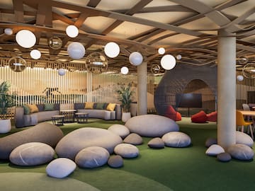 a large room with large rocks and a round object