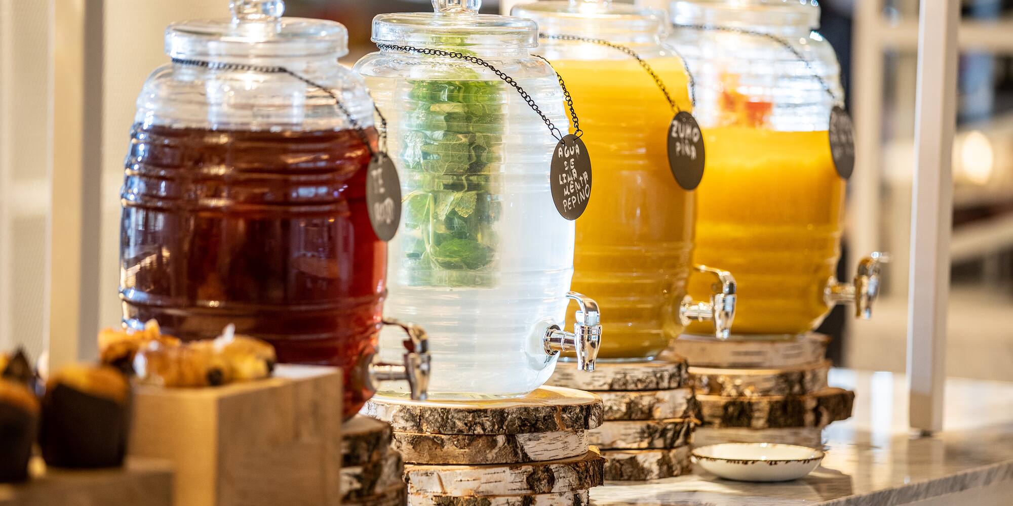 a row of different colored drinks