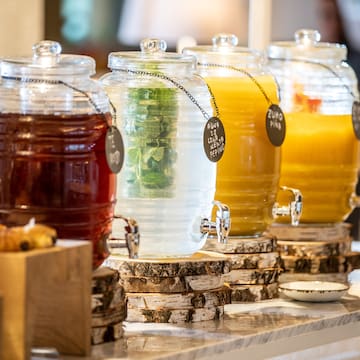 a row of different colored drinks