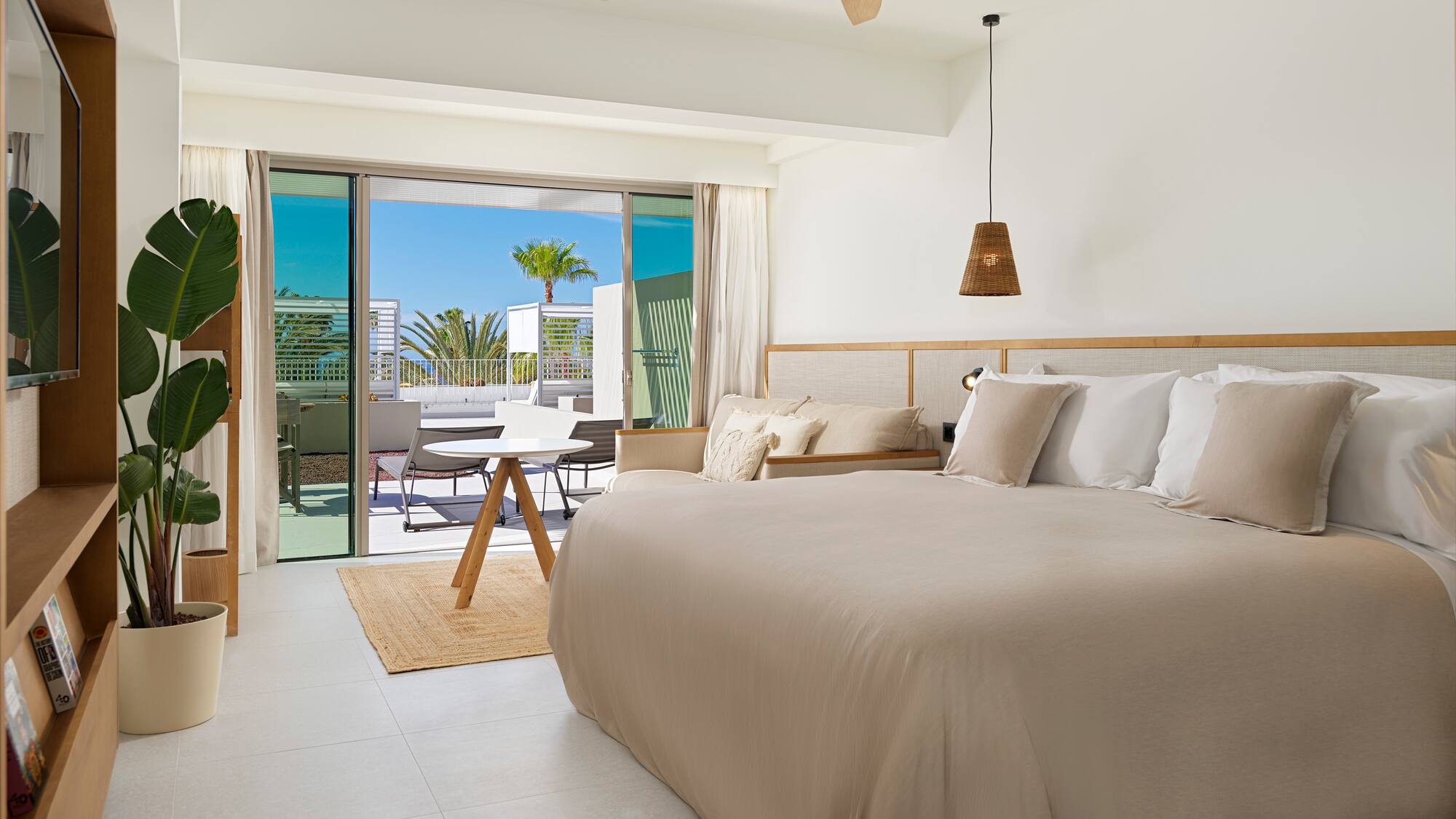 a bedroom with a bed and a ceiling fan