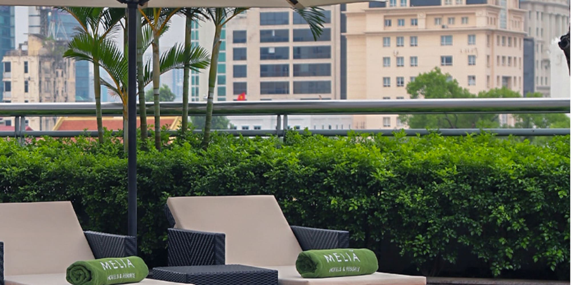 a group of chairs and umbrellas on a patio