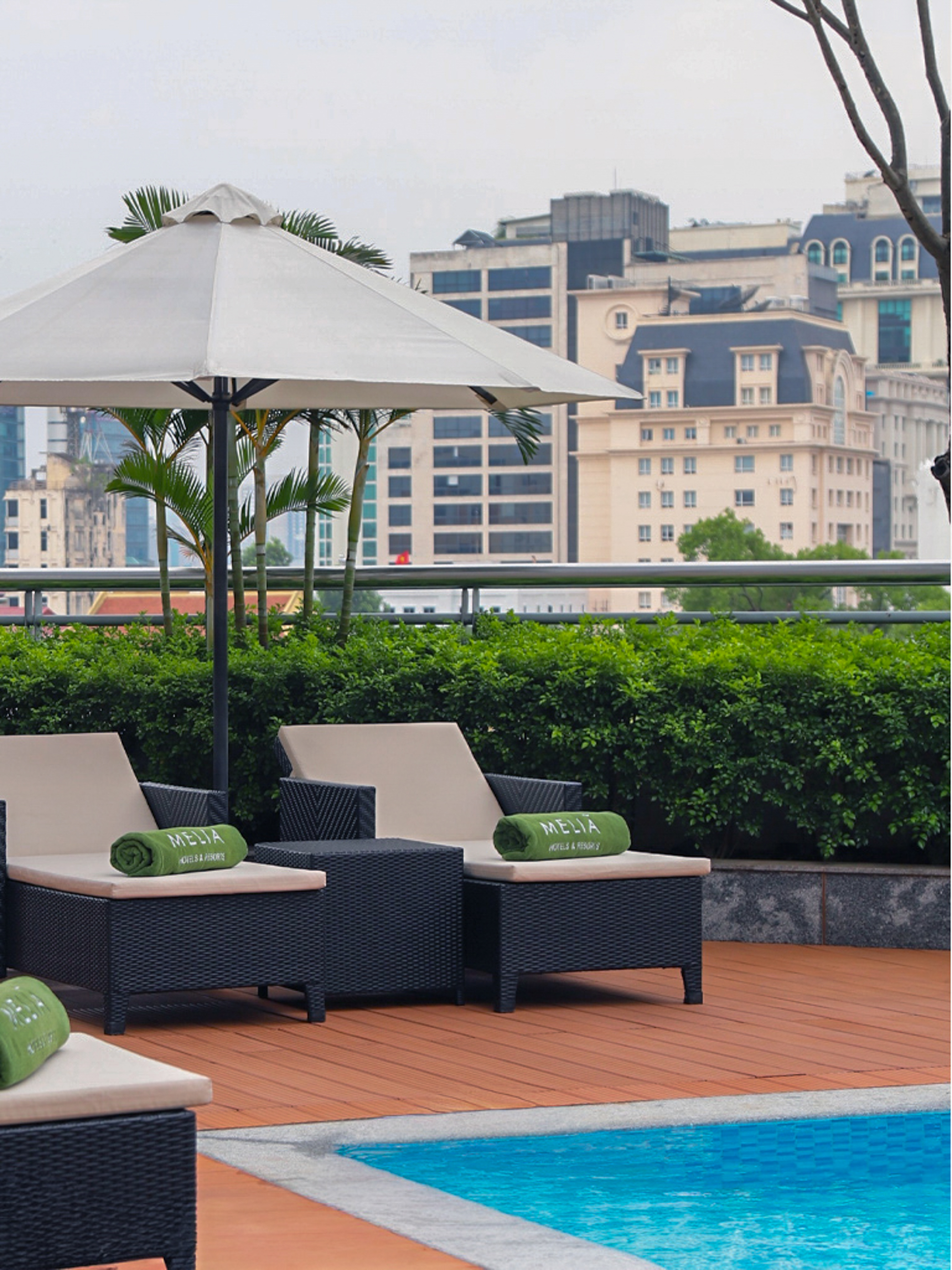 a group of chairs and umbrellas on a patio