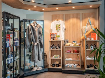 a room with shelves and shelves with a robe and bottles