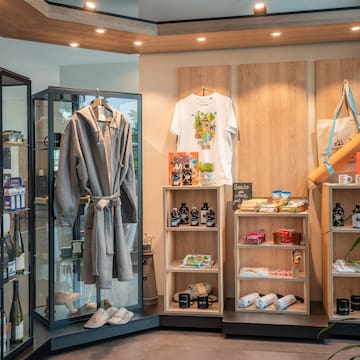 a room with shelves and shelves with a robe and bottles