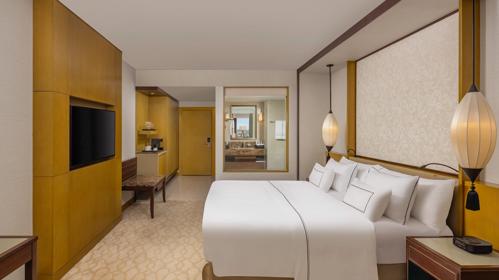 a room with a bed and a television