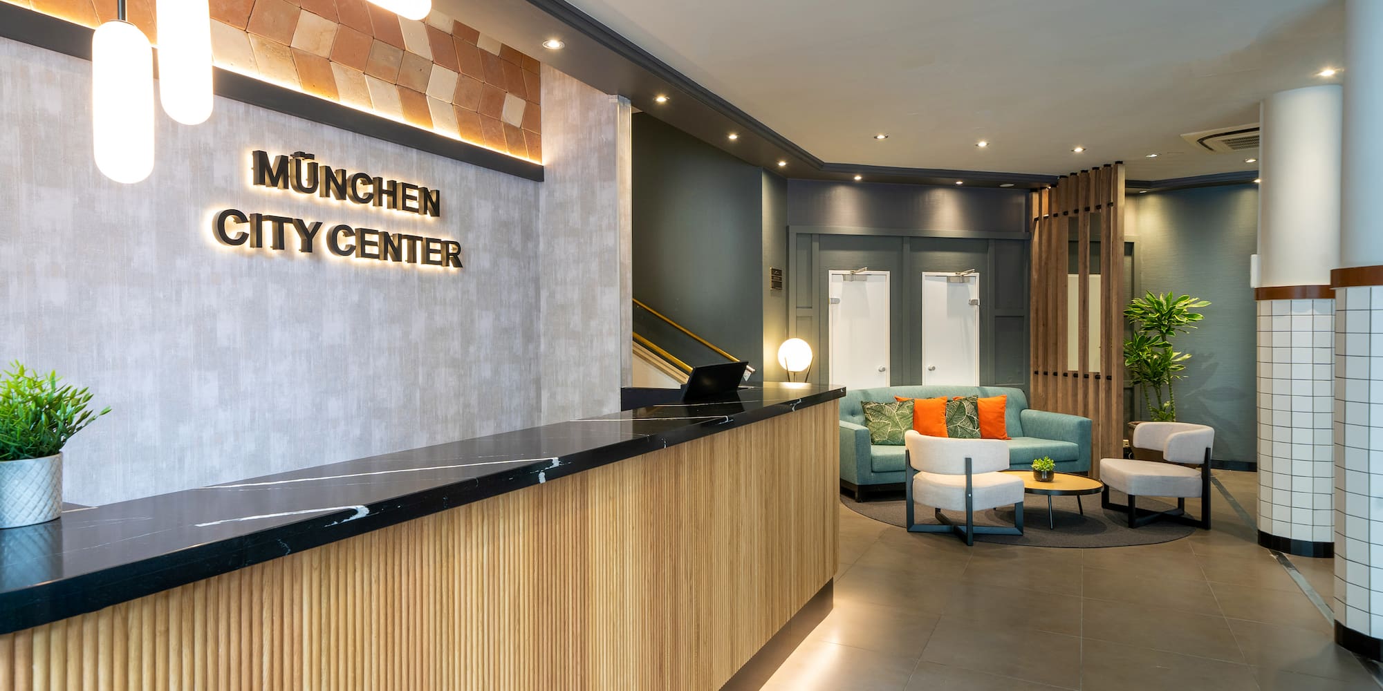 a lobby with a reception desk and chairs
