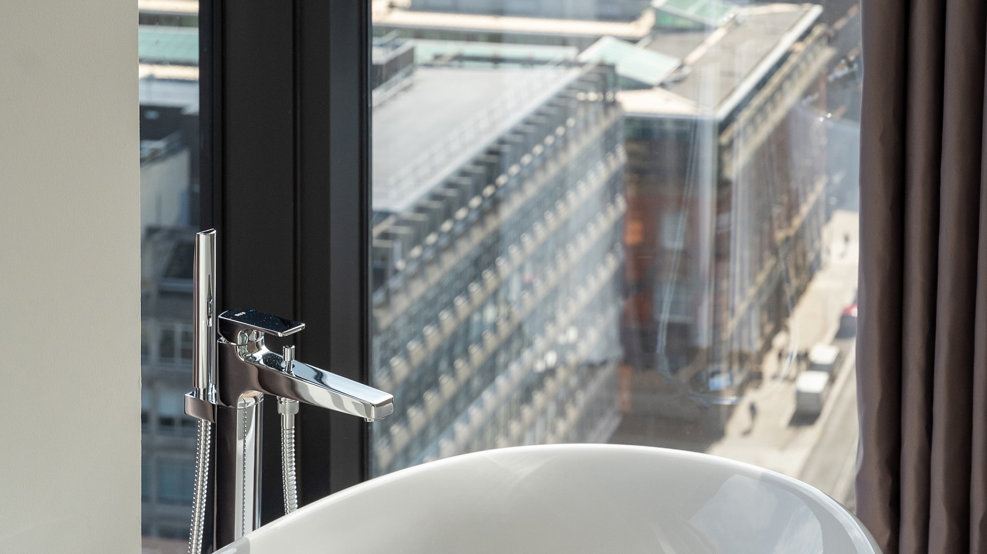 a bathtub in a bathroom with a window