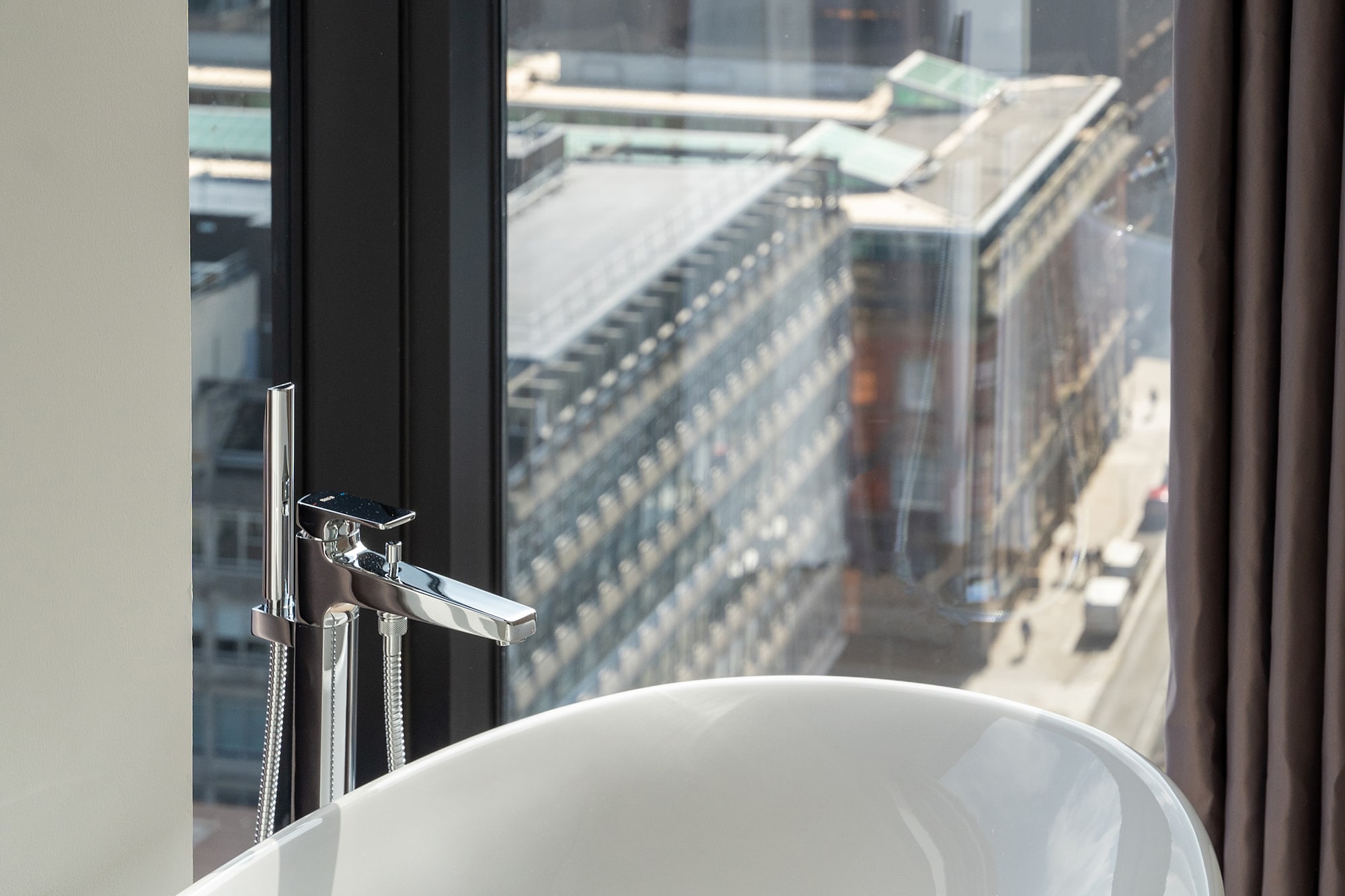 a bathtub in a bathroom with a window