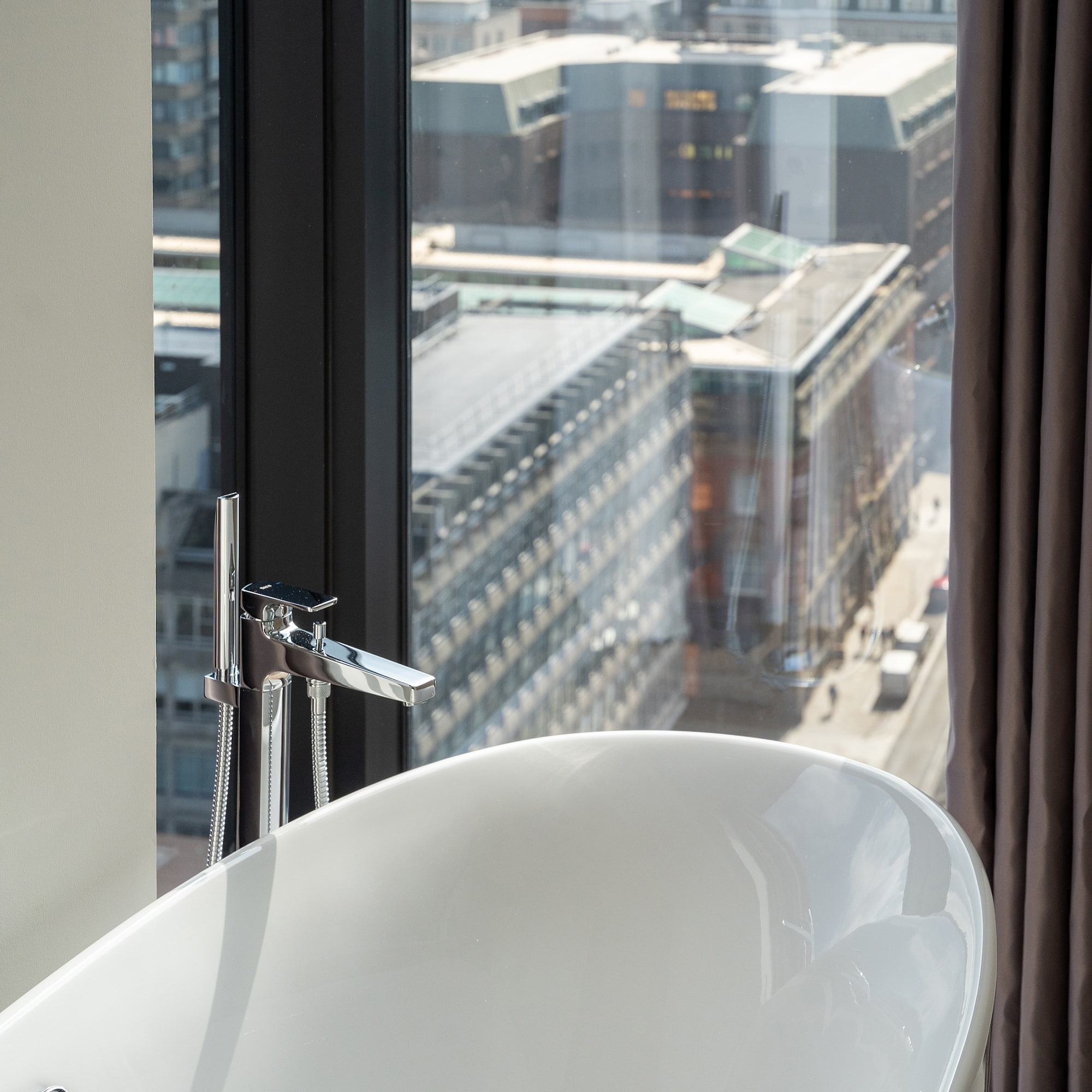 a bathtub in a bathroom with a window