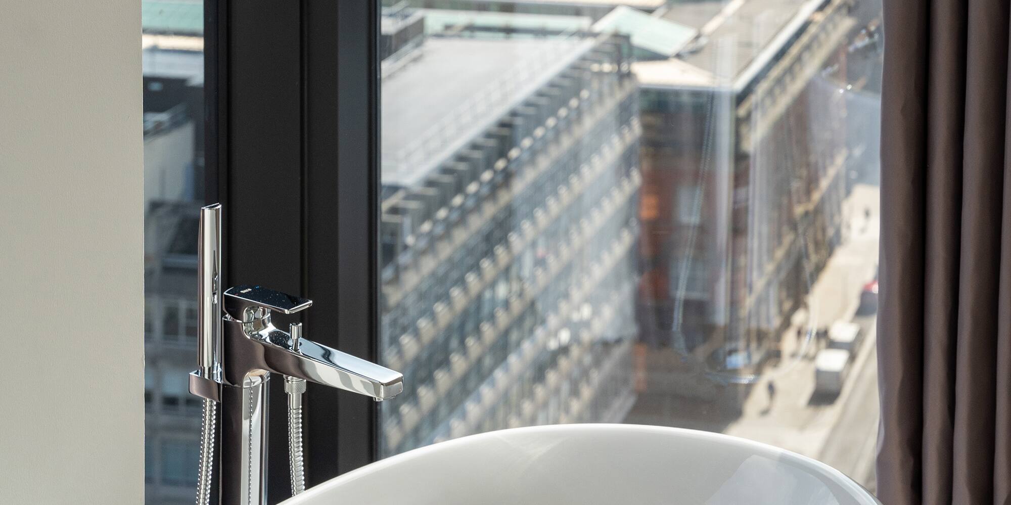 a bathtub in a bathroom with a window