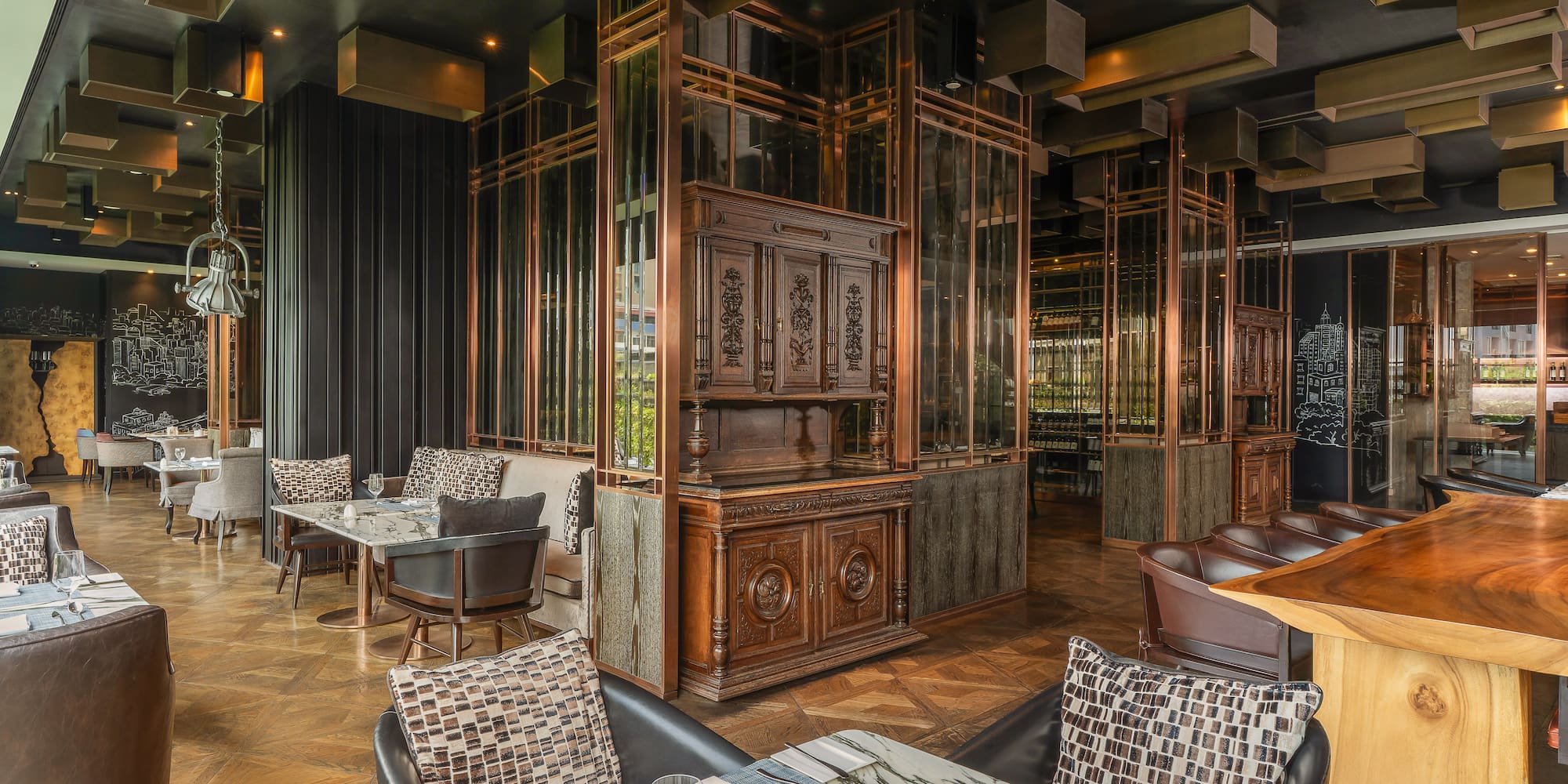 Luxury restaurant interior with marble tables, copper accents, and wooden cabinets. - Scalini, المطبخ  الايطالي - The Kasem House Bangkok Hotel Affiliated by Meliá, بانكوك