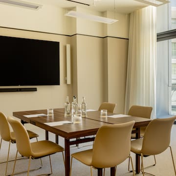 a room with a table and chairs